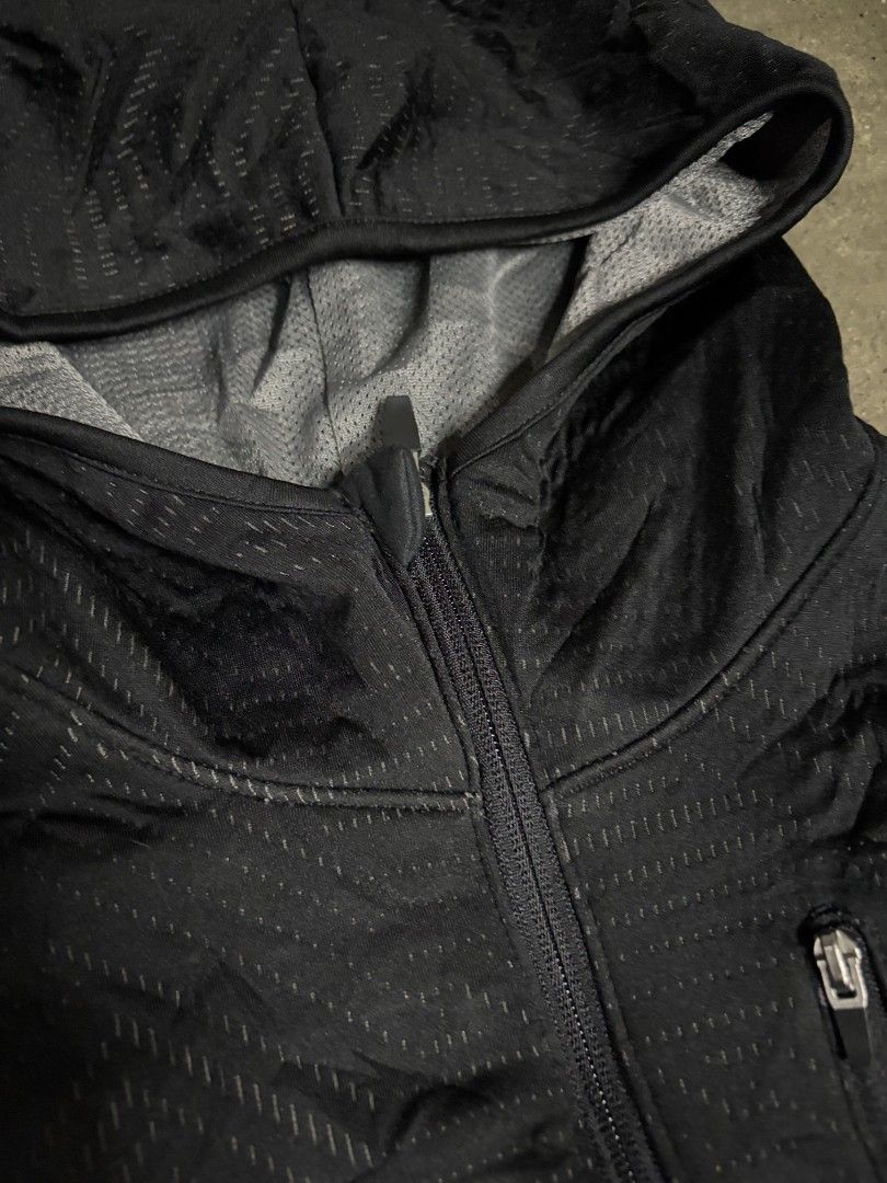 C9 Champion Black Full Zip Hoodie Jacket (Category: Coats, Jackets and Outerwear) located in San Jose. Submitted by rnb_thrift (Listing ID 1459930625, Image 3). Description: - Black Champion hoodie jacket - Size XL - Full zip closure - Chest pocket - Hooded design - Textured pattern on front chest - Ideal for workouts or casual wear.