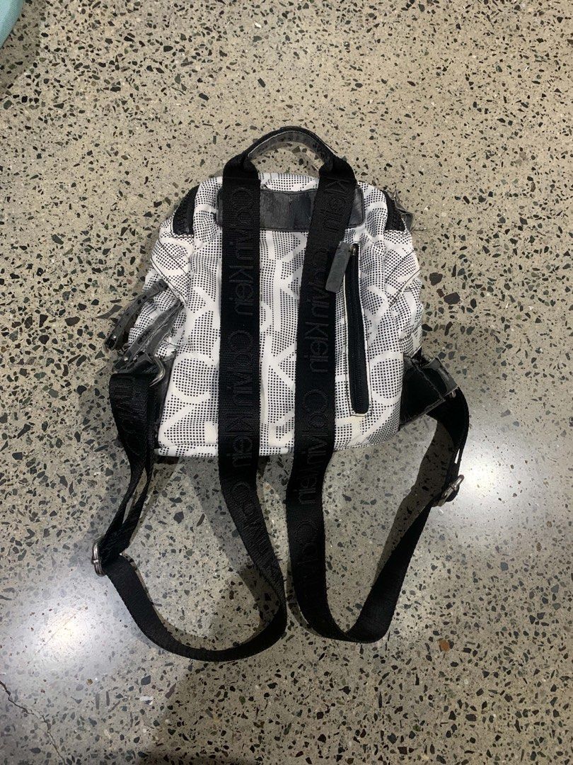 Calvin Klein All Over Logo Mini Backpack (Category: Backpacks) located in Manila. Submitted by everythingwlove (Listing ID 1460082787, Image 2). Description: - Cute Calvin Klein mini backpack - All-over CK logo print - Black mesh detail on the front - Adjustable straps for a comfortable fit - Zipped main compartment for secure storage - Ideal for everyday use or travel.