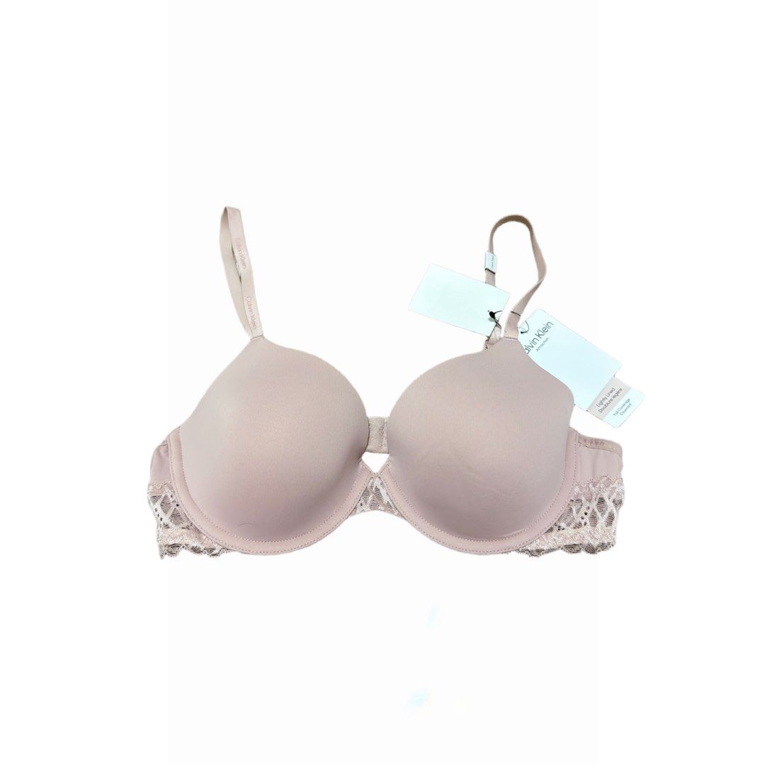Calvin Klein Lightly Lined Bra with Lace Trim (Category: Undergarments & Loungewear) located in Dasmarinas. Submitted by beisells (Listing ID 1460079979, Image 1). Description: Calvin Klein Bra - Bought from Canada - Brand: Calvin Klein - Style: Lightly lined, full coverage bra - Features: Pretty lace trim along the band - Straps: Adjustable with Calvin Klein logo detail - Condition: Brand new with original tags - Fabric: Comfortable and smooth.