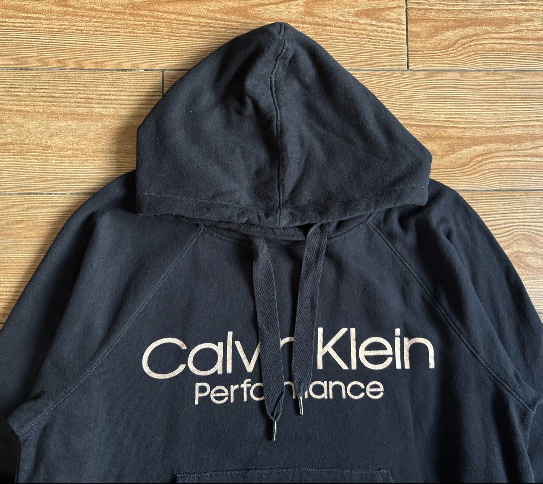 CALVIN KLEIN PERFORMANCE HOODIE JACKET (Category: Coats, Jackets and Outerwear) located in Makati City. Submitted by jnc__apparel (Listing ID 1460071659, Image 2). Description: 🏷️ CALVIN KLEIN PERFORMANCE HOODIE JACKET 📌 Dimes: 24L x 24.5W 📌 Size: Large for womens 📌 Condition: Like new 📌 Color rate: 10/10 📌 Issue: None ✅ Washed and ready to wear.