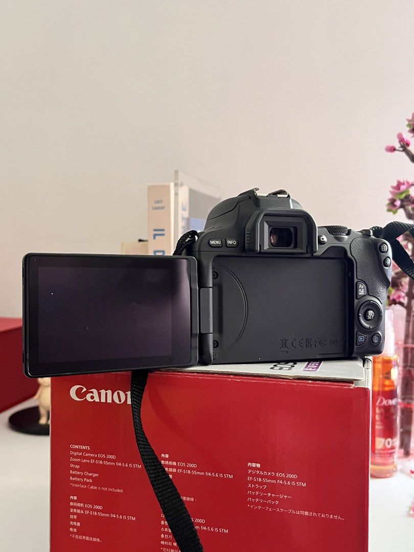 Canon EOS 200D Kit Lens with Box (Category: Cameras) located in Quezon City. Submitted by hellopucca (Listing ID 1459943975, Image 2). Description: - Canon EOS 200D DSLR camera - Comes with kit lens - Original box included - Lightweight and compact design - Ideal for beginners - No flaws except for the part near battery but no impact on performance. Battery still locks and its closing door..