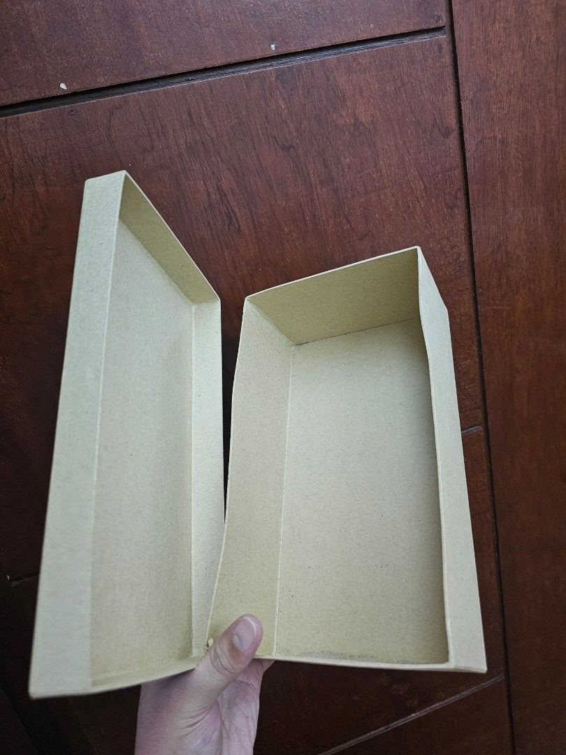 Cardboard Storage Box with Lid (Category: Storage Boxes & Baskets) located in Marikina City. Submitted by czarinahwithh (Listing ID 1459908921, Image 2). Description: - Plain cardboard box with a separate lid. - Ideal for organizing and storing small items. - Approximate dimensions: 9 inches (L) x 5 inches (W) x 3 inches (H). - Sturdy construction for reliable storage. - Suitable for gift packaging - 9 pcs available.