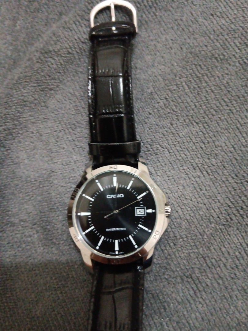 Casio Water Resist Watch Black Leather Strap (Category: Women's Watches) located in Manila. Submitted by ocyobe4man (Listing ID 1460047972, Image 1). Description: - Casio watch with black dial - Water resistant - Date display window - Black leather strap (shows wear and tear, especially near buckle) - Fully functional.