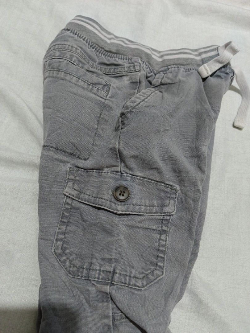 Cat & Jack Grey Cargo Jogger Pants Size 2T (Category: Babies & Kids Fashion) located in Makati City. Submitted by Thrifttoglam.ph (Listing ID 1460018967, Image 3). Description: - Toddler grey cargo jogger pants - Elastic waistband with drawstring - Two side pockets - Two cargo pockets with button closure - Cuffed ankles - Made in Bangladesh - Great for everyday wear.