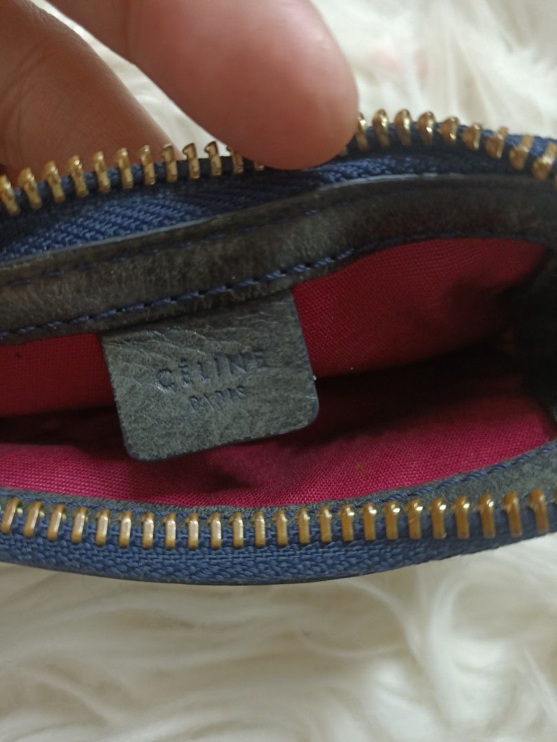 Celine Monogram Canvas Coin Pouch with Keychain (Category: Luxury Bags & Wallets) located in Bayombong. Submitted by rheaaa00530 (Listing ID 1460069585, Image 3). Description: - Authentic Celine coin pouch - Classic monogram canvas pattern - Black leather trim and details - Zipper closure - Red fabric interior lining - Includes gold-tone keychain - Compact size, ideal for coins or small items.