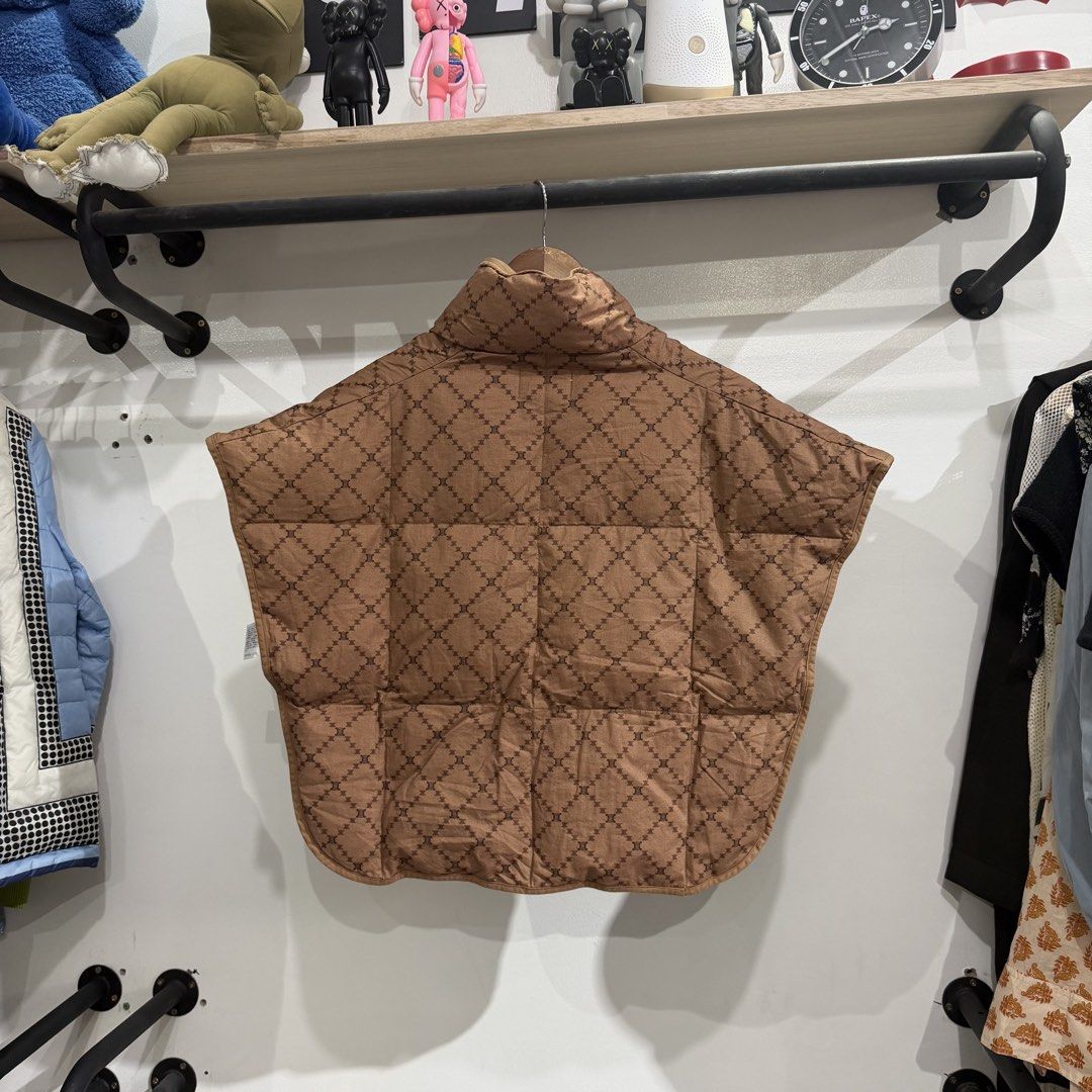 Celine Paris Puffer Monogram Vest (Category: Coats, Jackets and Outerwear) located in Bambang. Submitted by heats777 (Listing ID 1460081444, Image 3). Description: Excellent condition No issues Deaturing a puffer monogram designs .