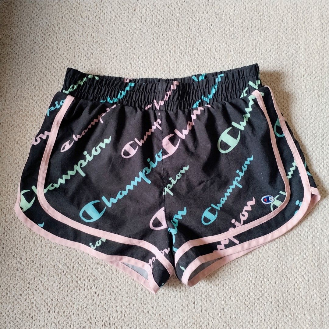 Champion Athleticwear Shorts Size M (Category: Shorts) located in Davao. Submitted by belles_pre_loved (Listing ID 1459911236, Image 1). Description: - Black Champion shorts with all-over logo print - Features a pastel colorway with pink and teal accents - Elastic waistband for a comfortable fit - Great for workouts or casual wear.