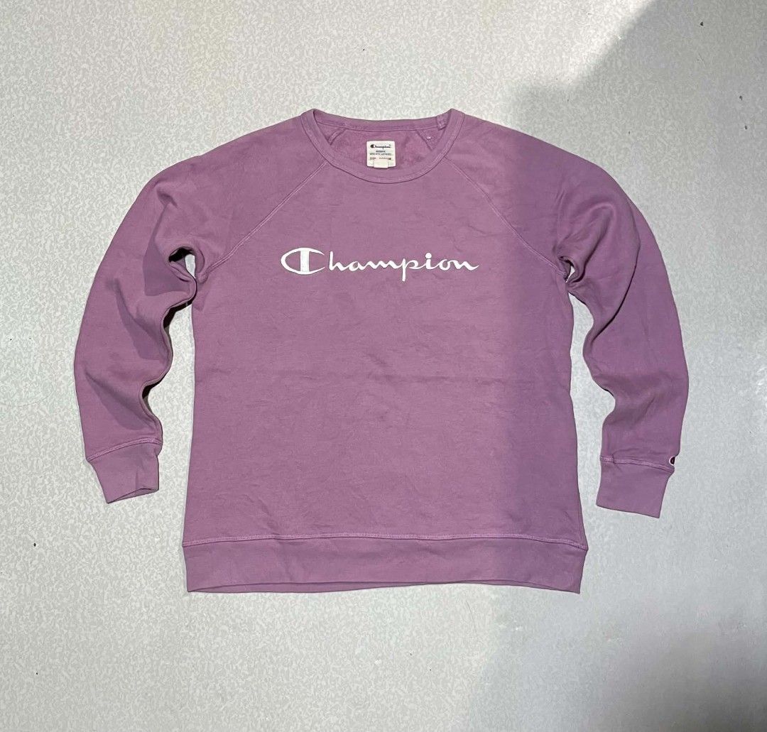 Champion Authentic Athletic Apparel Sweatshirt - Medium - Purple (Category: Coats, Jackets and Outerwear) located in Taguig. Submitted by 22nd_street_thrift (Listing ID 1460036347, Image 1). Description: - Champion raglan sleeve sweatshirt - Color: Purple - White Champion logo across the chest - Small C logo on the left sleeve cuff - Size: Medium - Made in China.