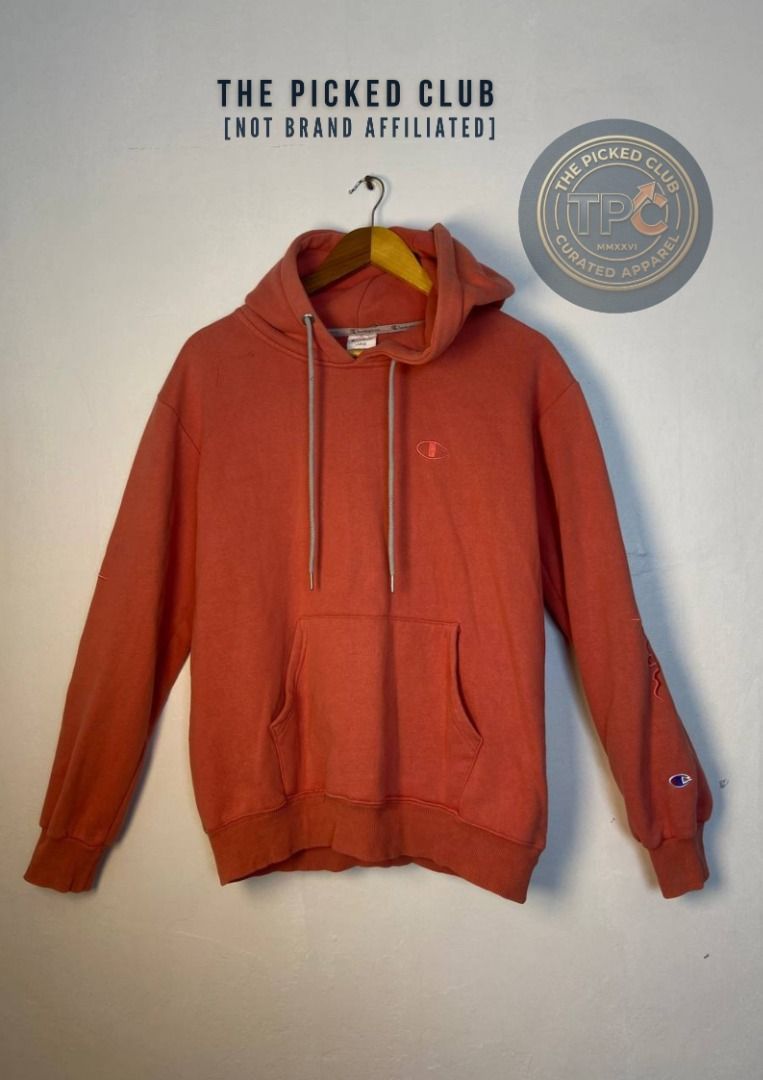 Champion Orange Hoodie (Category: Coats, Jackets and Outerwear) located in Imus. Submitted by thepickedclub (Listing ID 1460009042, Image 1). Description: large (22x25.5) - Orange Champion hoodie - Embroidered logo on chest and sleeve - Front pocket - Drawstring hood - Suitable for casual wear.