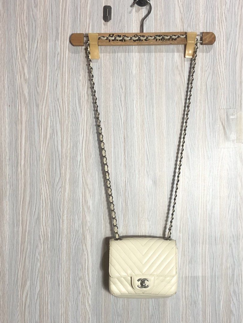 Chanel Leather Chevron Sling Bag Cream (Category: Luxury Bags & Wallets) located in Montevista. Submitted by rdthriftshub (Listing ID 1460071304, Image 2). Description: - Cream Leather Chanel Sling Bag - Classic Chevron Pattern - Elegant Silver Hardware - Interior Zip Pocket for essentials - Dimensions: 6.5" Wide x 5.5" Long.