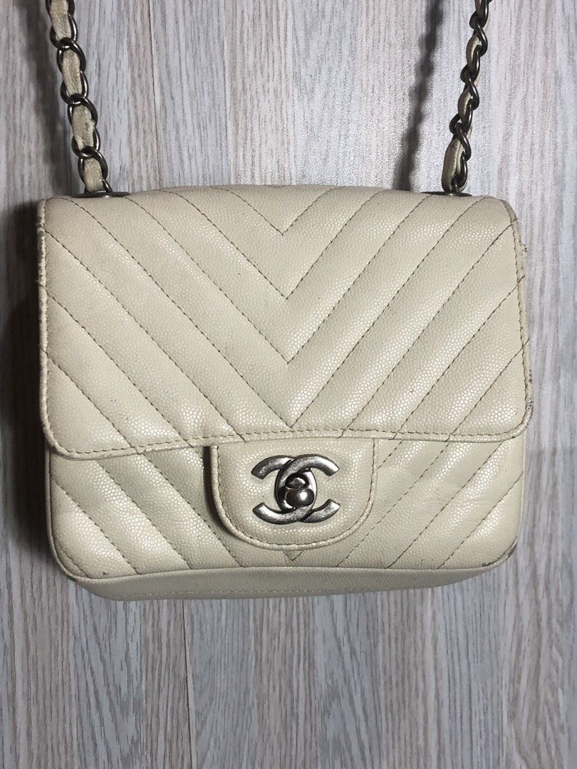 Chanel Leather Chevron Sling Bag Cream (Category: Luxury Bags & Wallets) located in Montevista. Submitted by rdthriftshub (Listing ID 1460071304, Image 3). Description: - Cream Leather Chanel Sling Bag - Classic Chevron Pattern - Elegant Silver Hardware - Interior Zip Pocket for essentials - Dimensions: 6.5" Wide x 5.5" Long.