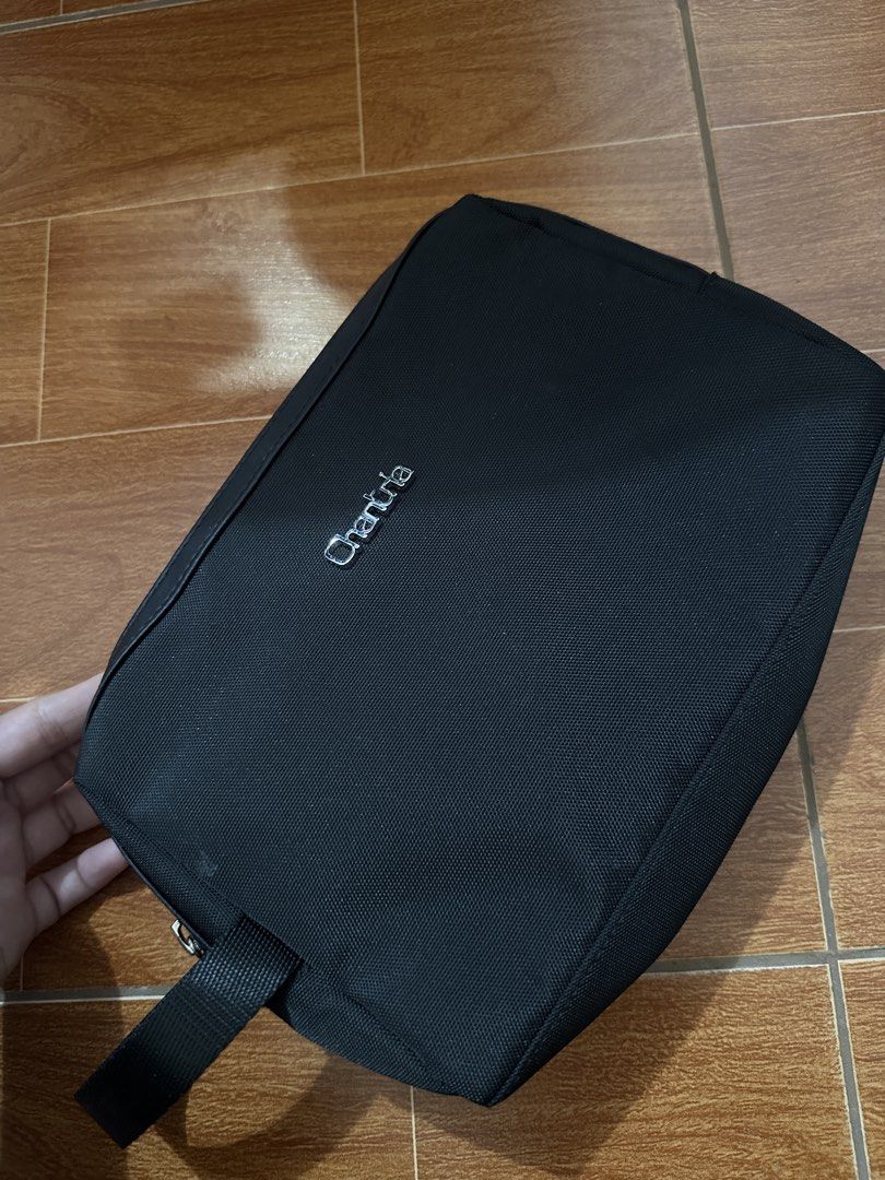 Chantrila Black Cosmetic Bag / Pouch (Category: Luxury Bags & Wallets) located in Mandaluyong City. Submitted by vastrabbit.138b36 (Listing ID 1459930548, Image 1). Description: - Black Chantrila cosmetic bag - Features a convenient handle loop - Ideal for travel or everyday use - Shows minor marks on the fabric - Secure zipper closure.