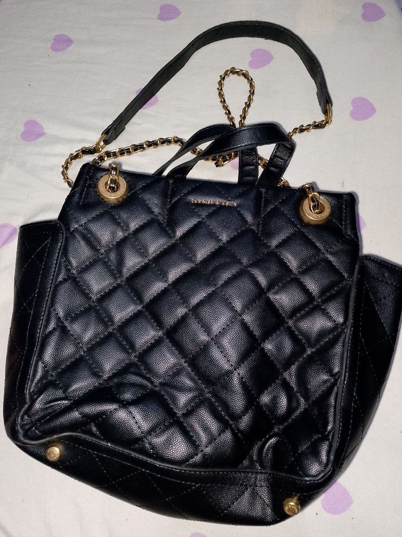 Charles & Keith Black Quilted Chain Backpack (Category: Backpacks) located in Bulacan. Submitted by cheolsimp17 (Listing ID 1459936111, Image 1). Description: - Black quilted backpack from Charles & Keith - Features gold chain straps and hardware - Secure zip closure - Versatile for everyday use or evening outings - can lower pa yung price just dm me loc. Bulacan.