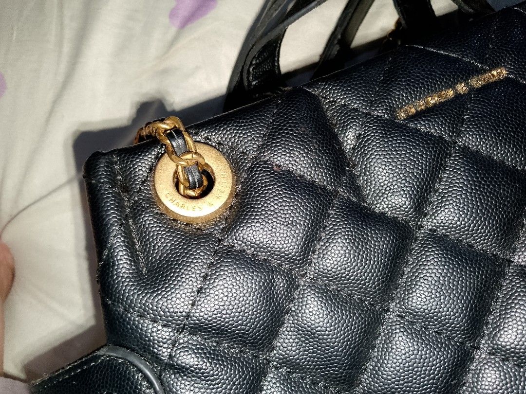 Charles & Keith Black Quilted Chain Backpack (Category: Backpacks) located in Bulacan. Submitted by cheolsimp17 (Listing ID 1459936111, Image 2). Description: - Black quilted backpack from Charles & Keith - Features gold chain straps and hardware - Secure zip closure - Versatile for everyday use or evening outings - can lower pa yung price just dm me loc. Bulacan.