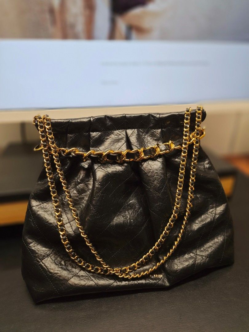 Charles & Keith Black Quilted Chain Shoulder Bag (Category: Shoulder Bags) located in Taytay. Submitted by allthingslove_riz (Listing ID 1460019700, Image 1). Description: - Brand: Charles & Keith - Style: Quilted Shoulder Bag - Color: Black - Material: Crinkled texture - Hardware: Gold chain strap - Closure: Zipper - Versatile: Great for casual or dressy looks Such a steal! In really great shape. Used 2x only! Comes with its original dust bag..