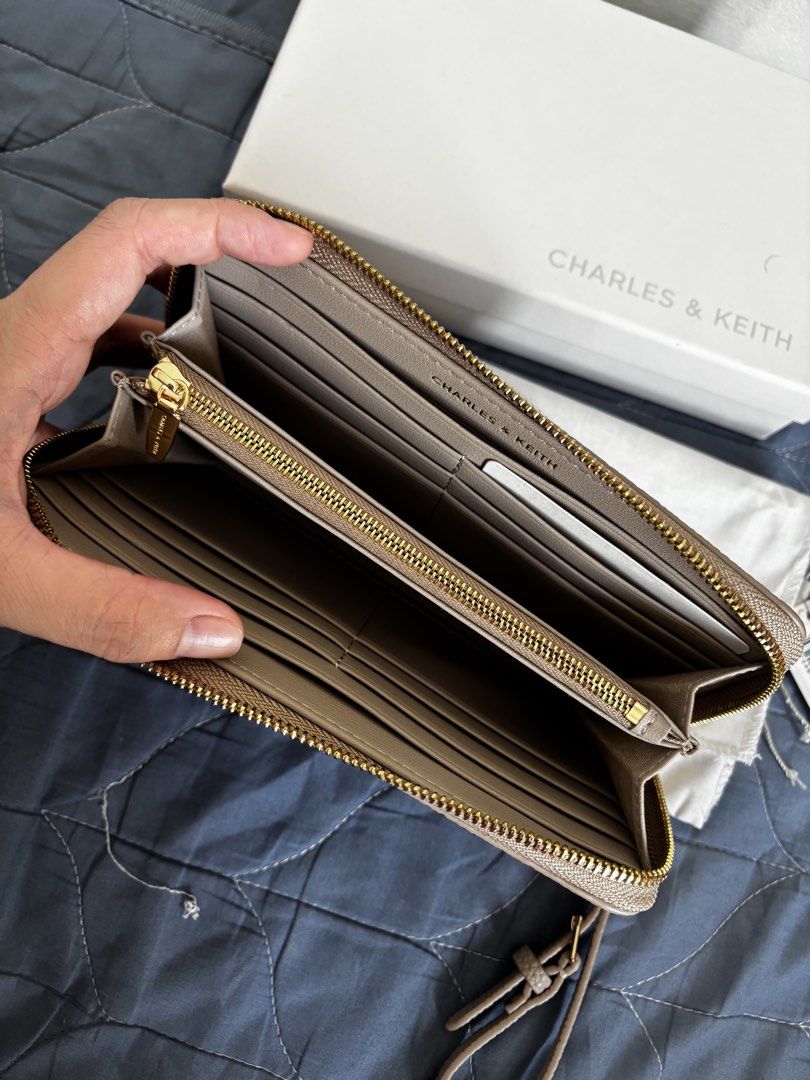 Charles & Keith Chance (Category: Wallets & Card holders) located in Manila. Submitted by declutter_byjaq (Listing ID 1459969069, Image 3). Description: Charles & Keith Chance CK6-20701692 Taupe Used twice only In excellent condition (can pass as Brandnew) with Tag,Dustbag,Box and Receipt Bought at Charles & Keith SM Megamall (exchange item) RFS: Needs Cash.