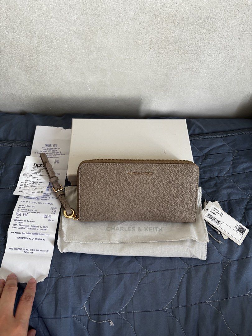 Charles & Keith Chance (Category: Wallets & Card holders) located in Manila. Submitted by declutter_byjaq (Listing ID 1459969069, Image 1). Description: Charles & Keith Chance CK6-20701692 Taupe Used twice only In excellent condition (can pass as Brandnew) with Tag,Dustbag,Box and Receipt Bought at Charles & Keith SM Megamall (exchange item) RFS: Needs Cash.