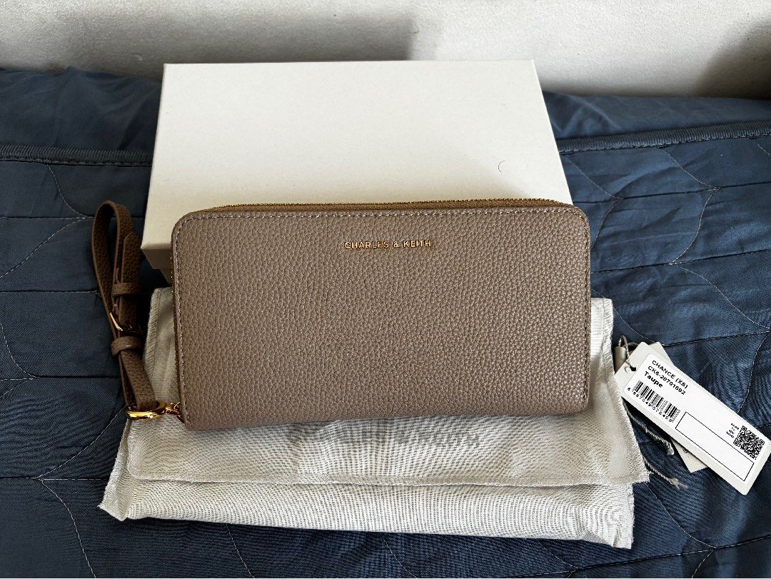 Charles & Keith Chance (Category: Wallets & Card holders) located in Manila. Submitted by declutter_byjaq (Listing ID 1459969069, Image 2). Description: Charles & Keith Chance CK6-20701692 Taupe Used twice only In excellent condition (can pass as Brandnew) with Tag,Dustbag,Box and Receipt Bought at Charles & Keith SM Megamall (exchange item) RFS: Needs Cash.