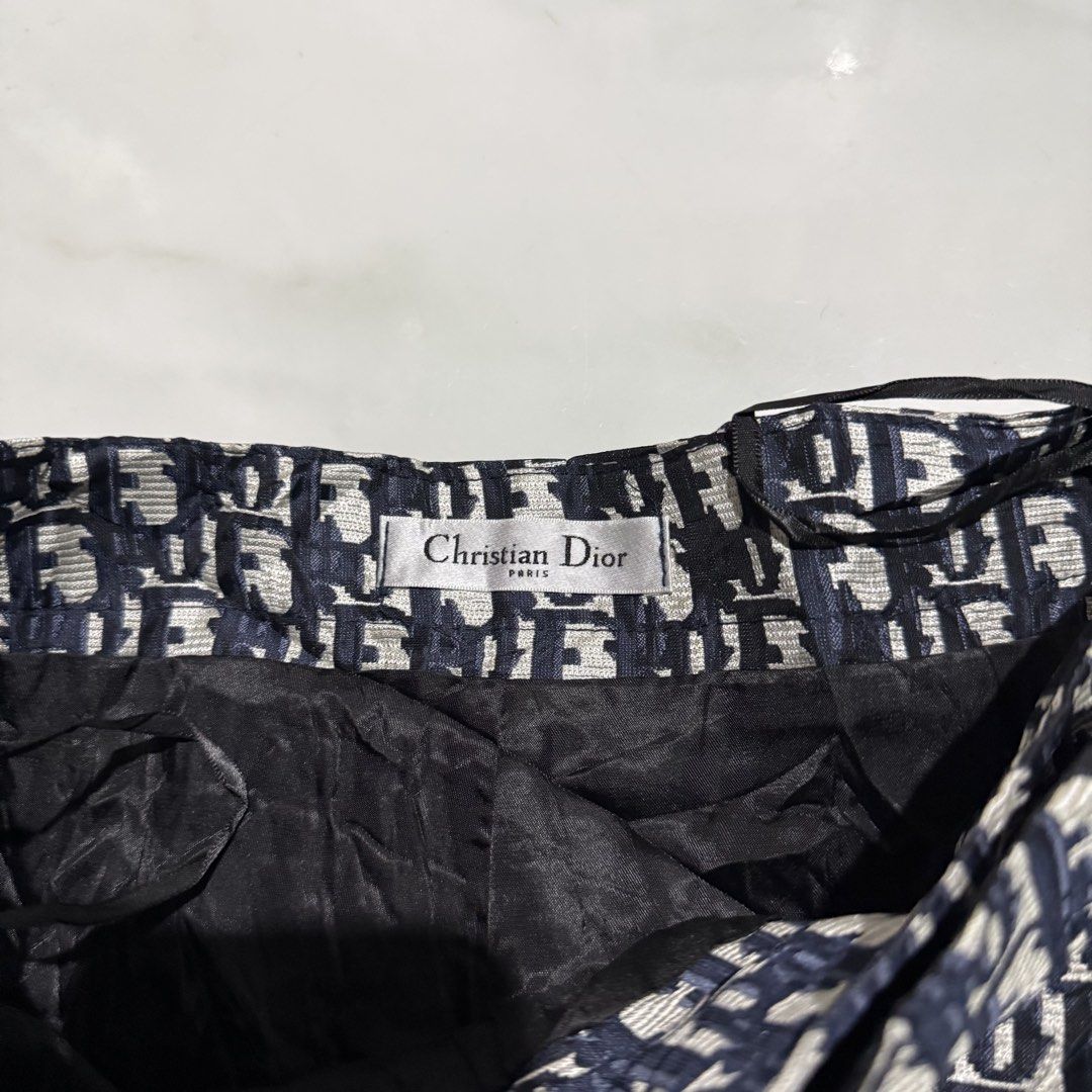 Christian Dior All-Over Logo Shorts (Category: Shorts) located in Manila. Submitted by preciousma24494 (Listing ID 1460020258, Image 3). Description: - Iconic Christian Dior all-over logo print size:28 - Dark blue and white colorway - Black buckle detail and drawstring - Lined interior - Perfect statement piece for a bold look.