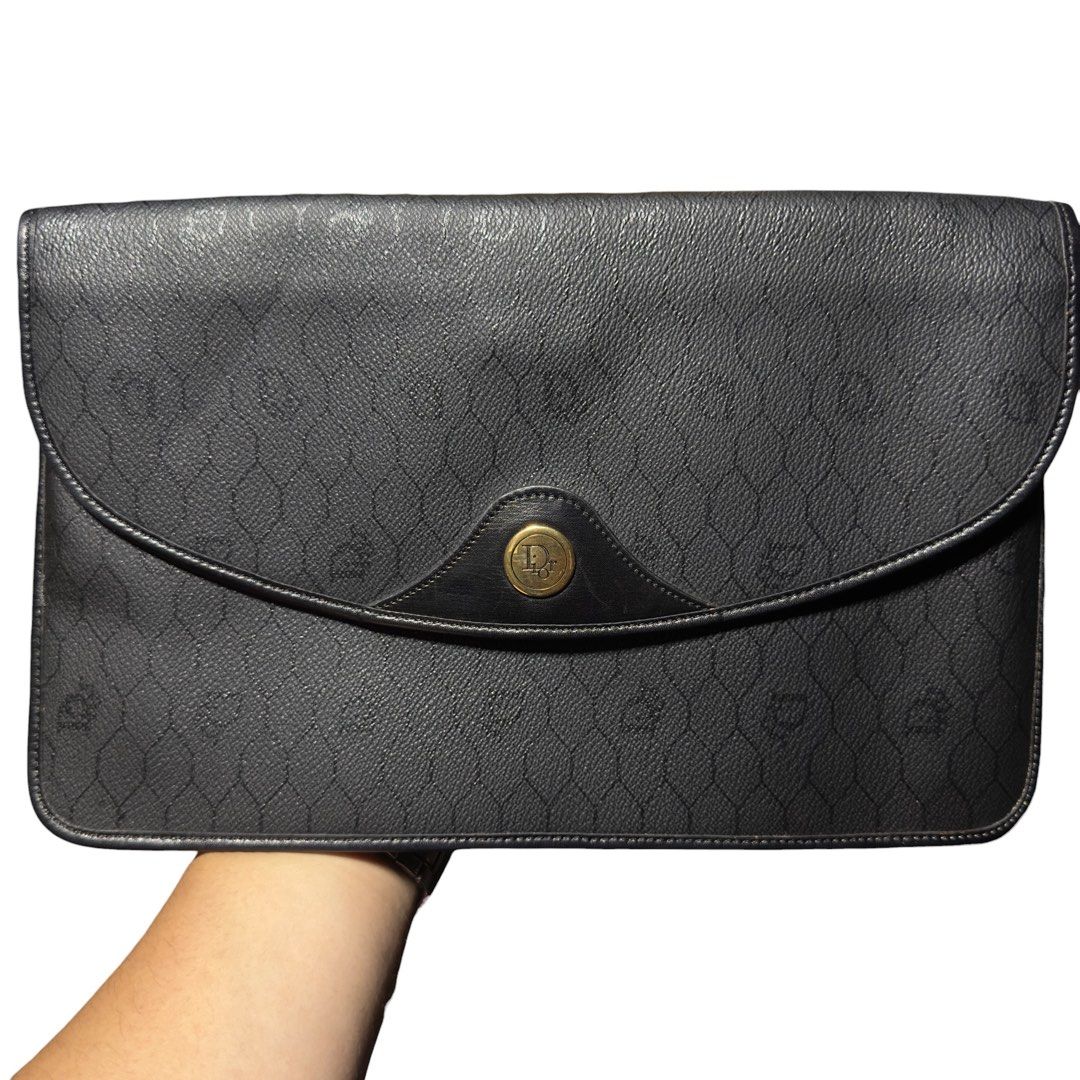Christian Dior Monogram Clutch Bag (Category: Luxury Bags & Wallets) located in Manila. Submitted by gladragzmnl (Listing ID 1459942092, Image 1). Description: - Vintage Christian Dior clutch - Iconic black Dior monogram pattern - Secure gold clasp closure - Authentically made in France - Ideal for carrying your essentials.