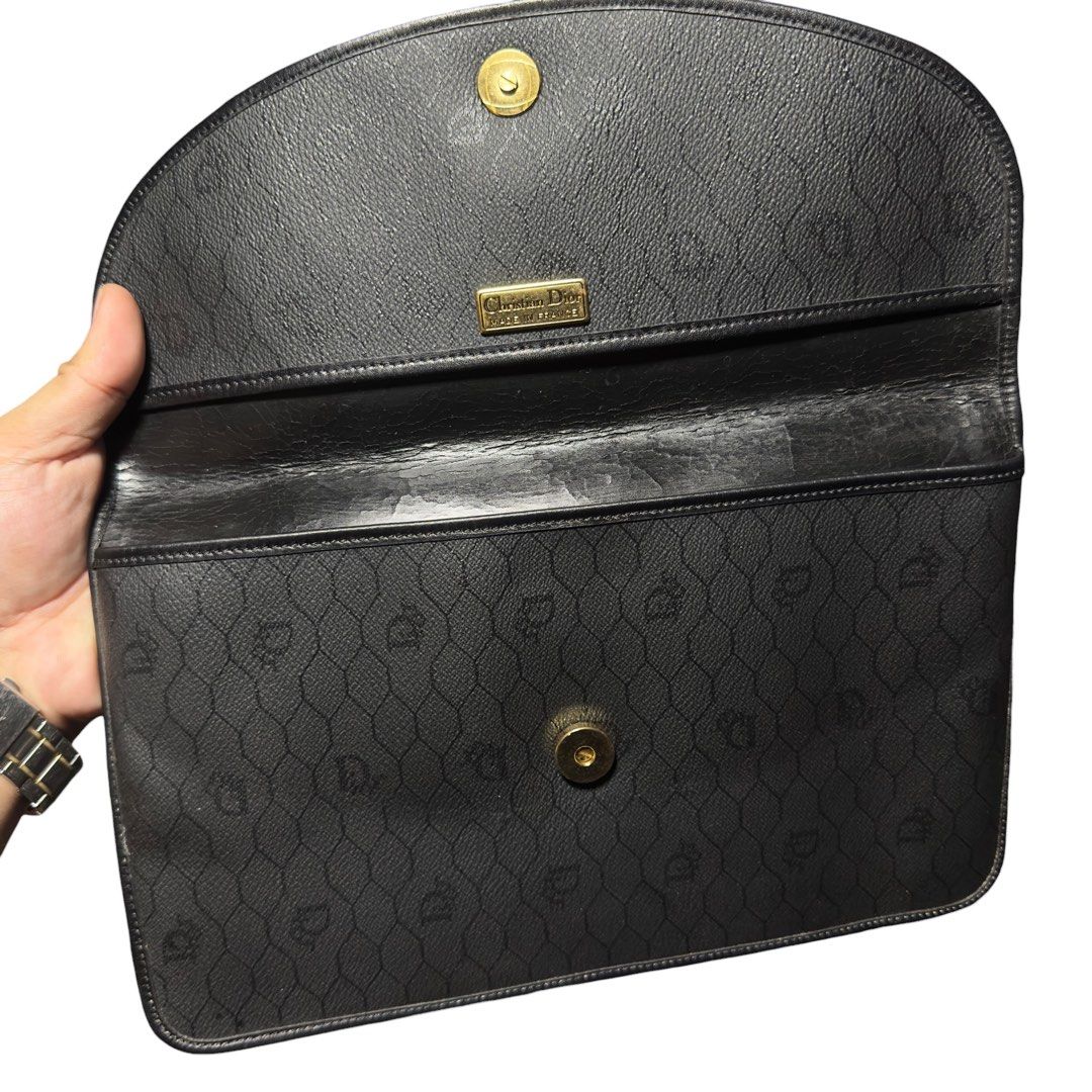 Christian Dior Monogram Clutch Bag (Category: Luxury Bags & Wallets) located in Manila. Submitted by gladragzmnl (Listing ID 1459942092, Image 2). Description: - Vintage Christian Dior clutch - Iconic black Dior monogram pattern - Secure gold clasp closure - Authentically made in France - Ideal for carrying your essentials.