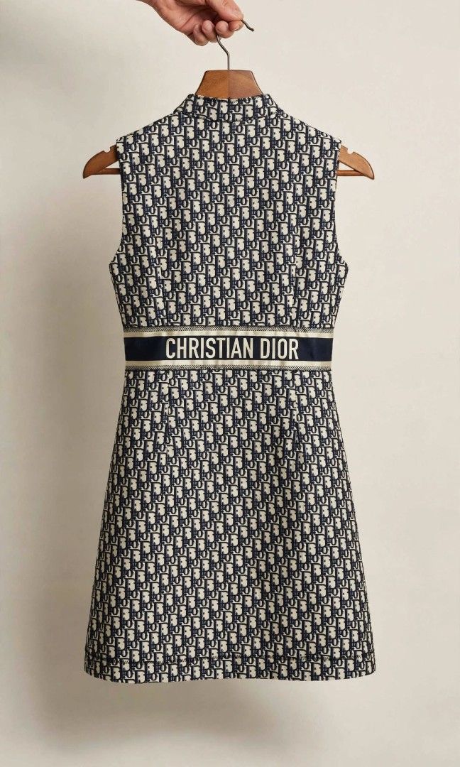 Dior Dress Oblique Monogram (Category: Luxury Apparel) located in Baguio. Submitted by royalprestigerouge (Listing ID 1459935116, Image 2). Description: Brand: Christian Dior Paris • Size: L (fits US 8-10 / M-L) • Material: 85% Cotton, 15% Polyester - Made in Italy • Design: Mandarin collar with half-zip front, signature navy waistband with gold trim and “CHRISTIAN DIOR” logo tape, A-line midi silhouette • Condition: Excellent pre-owned condition