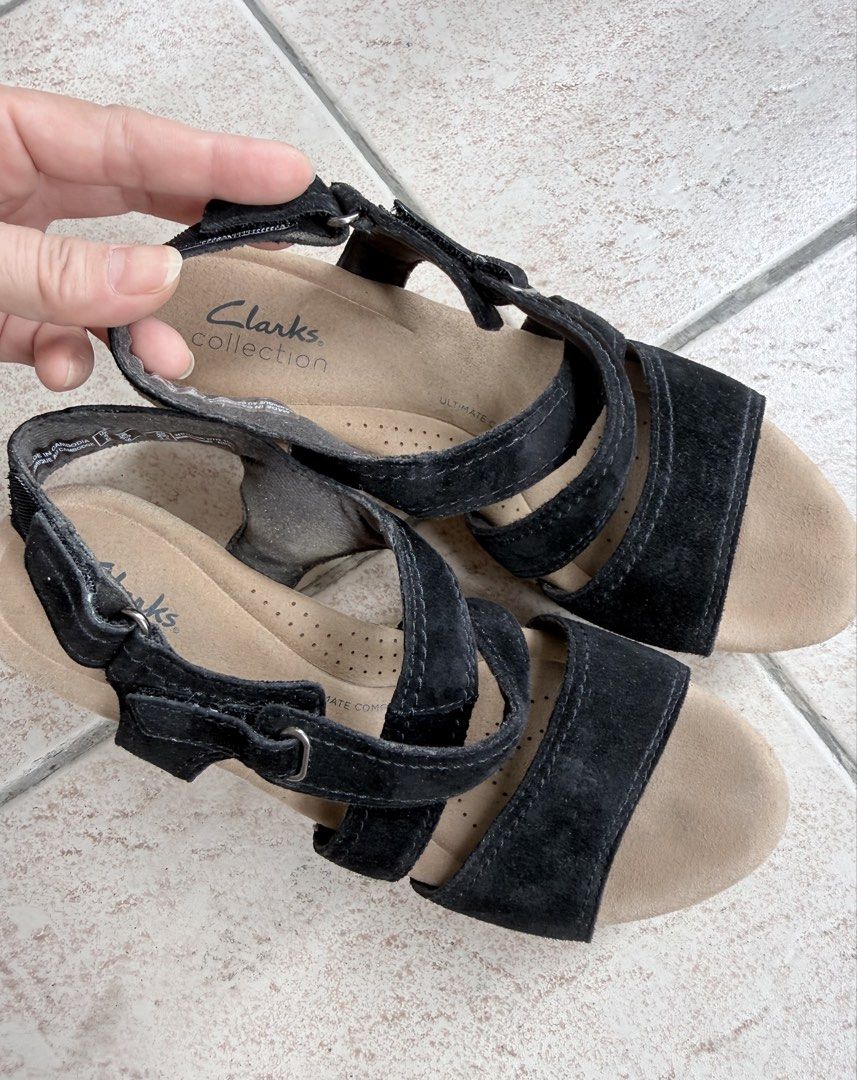 Clarks Collection Black Suede Wedge Sandals (Category: Wedges) located in Pasig City. Submitted by lonelydove (Listing ID 1459942236, Image 1). Description: - Brand: Clarks Collection - Material: Black Suede - Style: Wedge Sandals - Closure: Adjustable velcro straps - Heel: Cork wedge - Comfort: Comfortable for everyday wear - Size: 6.5 (US Women's), EU 37.