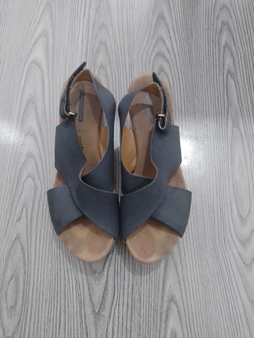 Clarks Collection Blue Leather Wedge Sandals³ (Category: Wedges) located in General Trias. Submitted by belinajg (Listing ID 1459978134, Image 1). Description: - Clarks Collection blue leather slingback sandals - Size 7 US - Crossover strap design - Comfortable cork wedge sole - Adjustable heel strap for a secure fit - Perfect for stylish everyday wear.