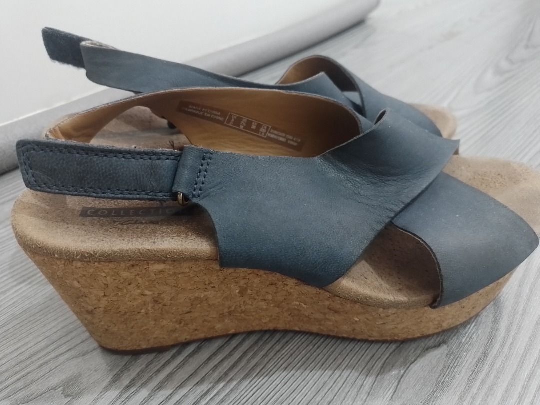 Clarks Collection Blue Leather Wedge Sandals³ (Category: Wedges) located in General Trias. Submitted by belinajg (Listing ID 1459978134, Image 2). Description: - Clarks Collection blue leather slingback sandals - Size 7 US - Crossover strap design - Comfortable cork wedge sole - Adjustable heel strap for a secure fit - Perfect for stylish everyday wear.