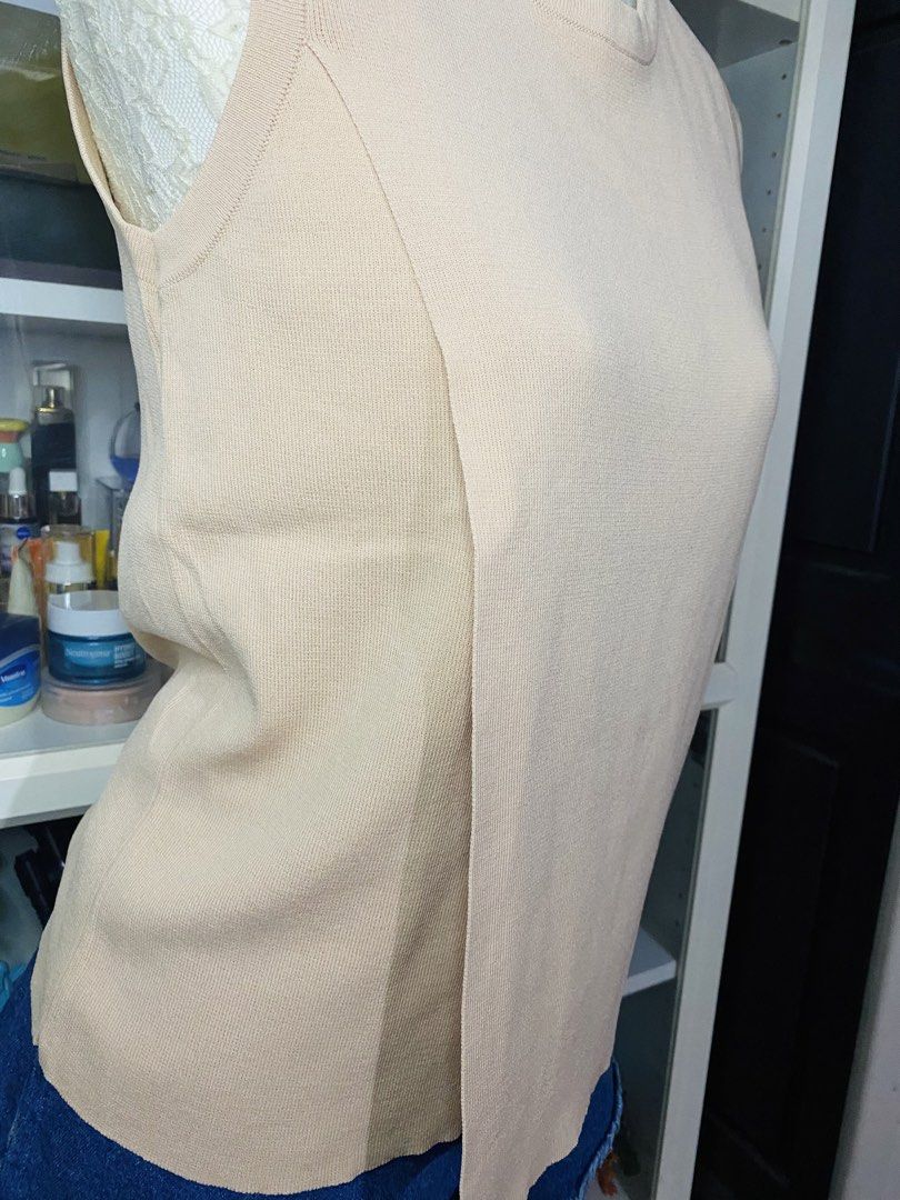 CLN Beige Sleeveless Knit Top (Category: Blouses) located in Manila. Submitted by glen_n (Listing ID 1460049606, Image 2). Description: CLN Beige Sleeveless Knit Top Size: Large Preloved - Good condition with normal signs of wear/wash. LP POSTED ❌NO When worn ❌NO Sh0pee checkout ❌ Strictly NO return/NO exchange policy.
