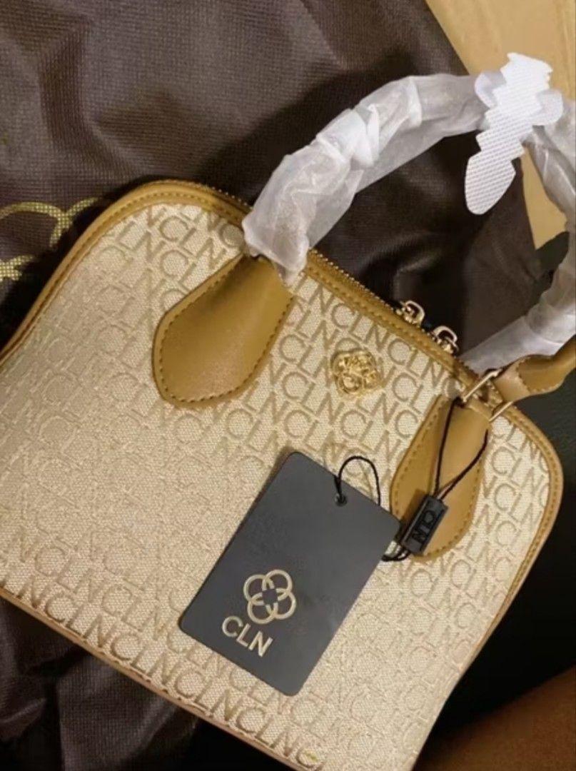 CLN Monogram Dome Bag with Sling (Category: Luxury Bags & Wallets) located in Manila. Submitted by ljaneee (Listing ID 1459975915, Image 2). Description: - Cute CLN dome bag - Features all-over CLN monogram print - Comes with a detachable sling strap - Also has top handles - Includes original dust bag and shopping bag - Ideal for everyday use.