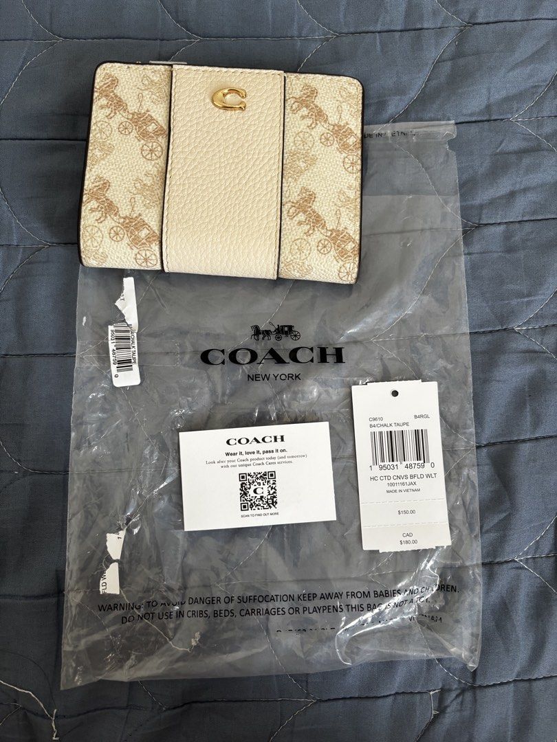 Coach Bifold Wallet (Category: Wallets & Card holders) located in Manila. Submitted by declutter_byjaq (Listing ID 1459971922, Image 1). Description: Coach Horse & Carriage Bifold Wallet Code: C9610 Color: Chalk Taupe With Tag,Care Card and Poly plastic From US RFS: Needs Cash.
