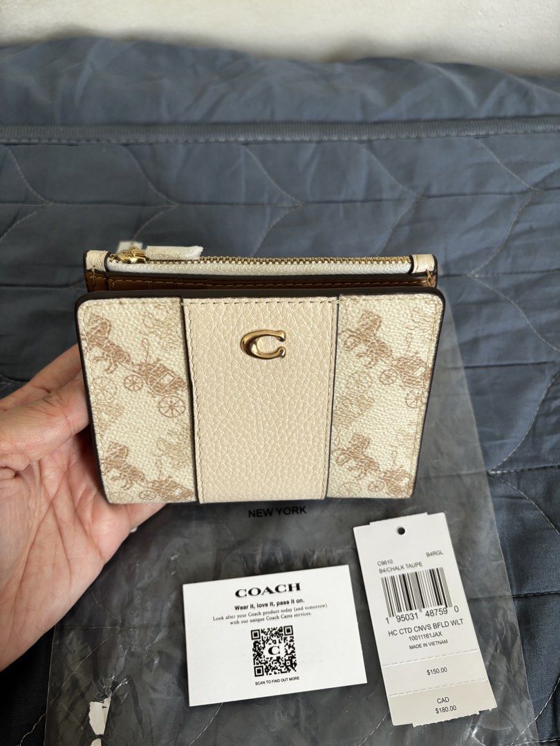 Coach Bifold Wallet (Category: Wallets & Card holders) located in Manila. Submitted by declutter_byjaq (Listing ID 1459971922, Image 2). Description: Coach Horse & Carriage Bifold Wallet Code: C9610 Color: Chalk Taupe With Tag,Care Card and Poly plastic From US RFS: Needs Cash.