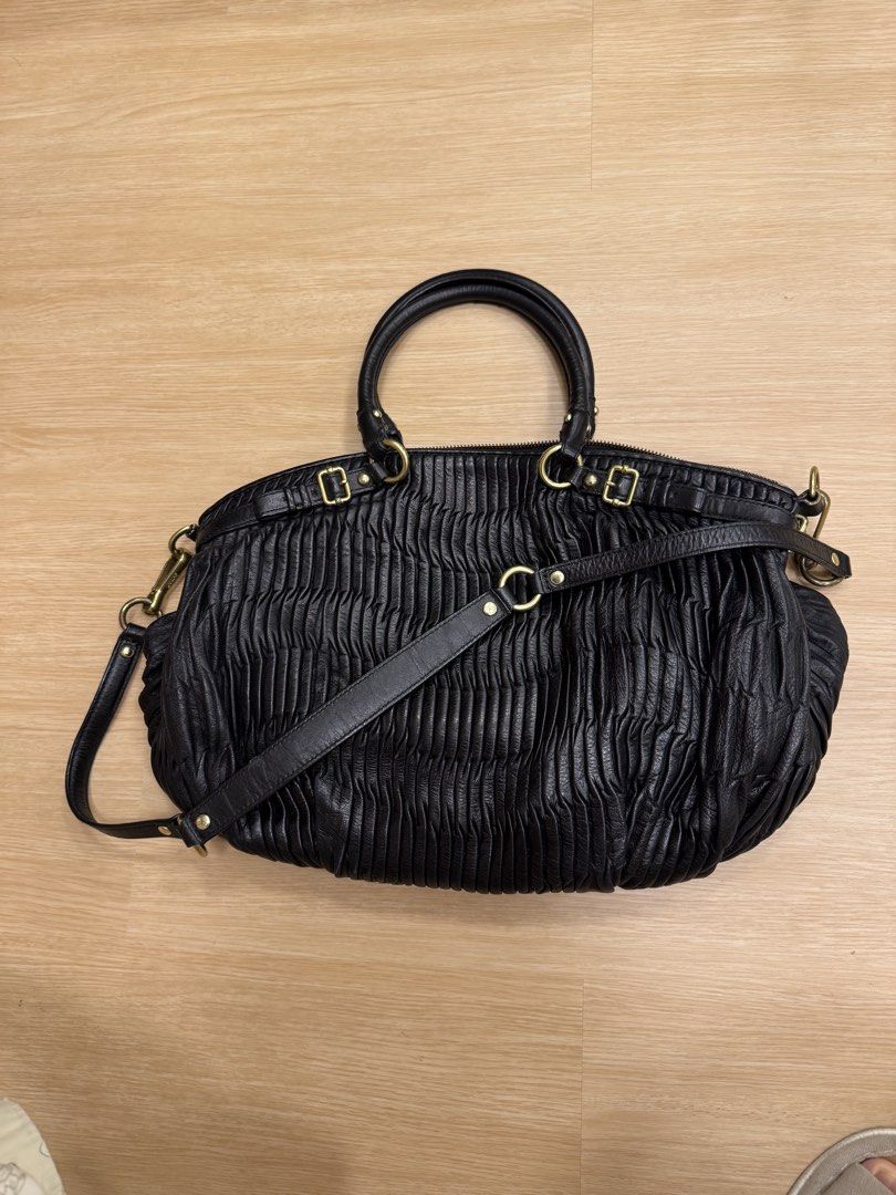 Coach Black Leather Ruched Satchel Shoulder Bag (Category: Luxury Bags & Wallets) located in Cainta. Submitted by recyclingroom (Listing ID 1460042365, Image 2). Description: 16” width x 13” height x 6” flexible thickness - Authentic Coach bag in classic black leather - Elegant ruched detailing on the exterior - Polished gold-tone hardware - Dual top handles for easy carrying - Detachable shoulder strap for versatile wear - Spacious main compartm