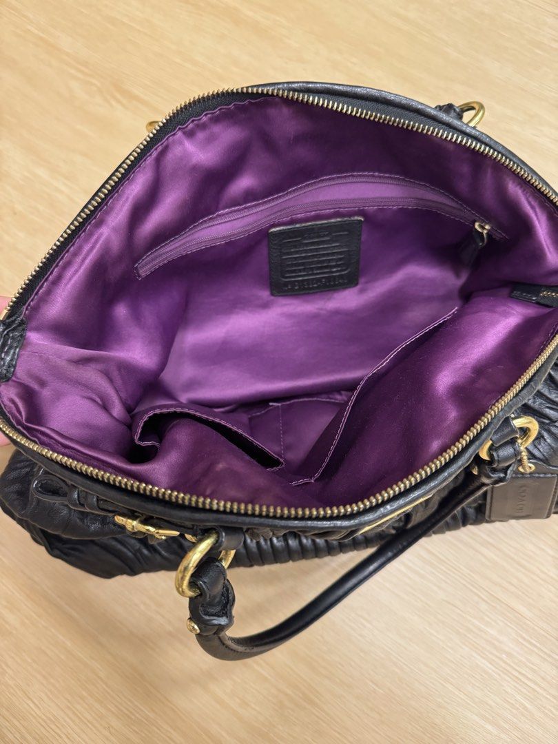 Coach Black Leather Ruched Satchel Shoulder Bag (Category: Luxury Bags & Wallets) located in Cainta. Submitted by recyclingroom (Listing ID 1460042365, Image 3). Description: 16” width x 13” height x 6” flexible thickness - Authentic Coach bag in classic black leather - Elegant ruched detailing on the exterior - Polished gold-tone hardware - Dual top handles for easy carrying - Detachable shoulder strap for versatile wear - Spacious main compartm