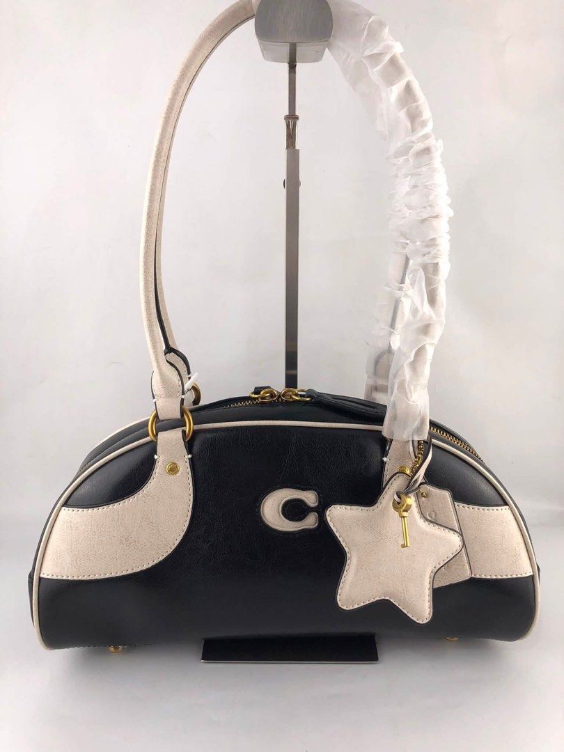 Coach Bowling Shoulder Bag Coachtopia (Category: Shoulder Bags) located in Marikina City. Submitted by smthxtra (Listing ID 1460033343, Image 3). Description: Length: 6.1 inches Height: 13.0 inches Width: 4.7 inches Handle Drop: 9.0 inches Zip-top closure With interior pouch Charms included With tag, care card, dust bag, and paper bag included Free shipping .