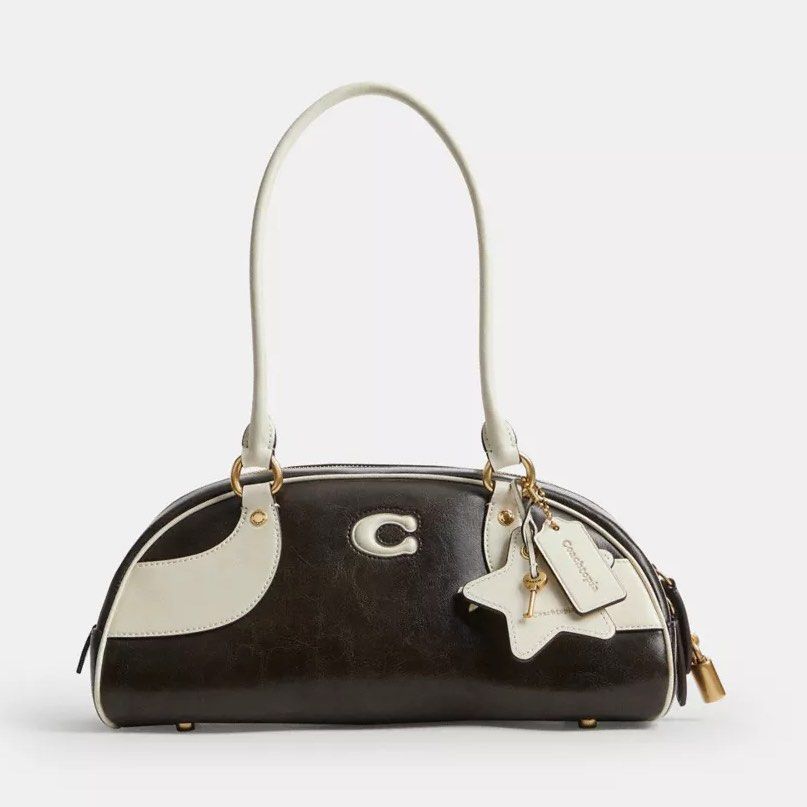 Coach Bowling Shoulder Bag Coachtopia (Category: Shoulder Bags) located in Marikina City. Submitted by smthxtra (Listing ID 1460033343, Image 2). Description: Length: 6.1 inches Height: 13.0 inches Width: 4.7 inches Handle Drop: 9.0 inches Zip-top closure With interior pouch Charms included With tag, care card, dust bag, and paper bag included Free shipping .