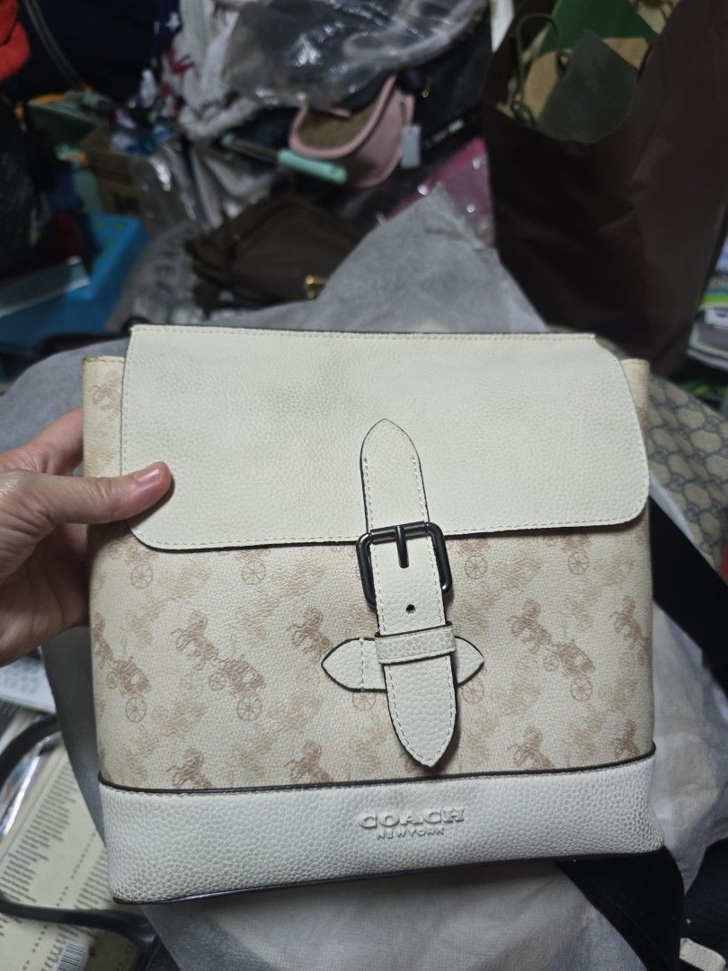 COACH Hudson Messenger Bag (Category: Shoulder Bags) located in Quezon City. Submitted by thegoodsplanetmnl (Listing ID 1459913059, Image 1). Description: Printed coated canvas and natural pebble leather Inside zip pocket Flap closure, fabric lining Adjustable strap with 20 1/2" drop for shoulder or crossbody wear 8 3/4" (l) x 9" (h) x 2 1/4" (w) rfs: never use and decluttering.