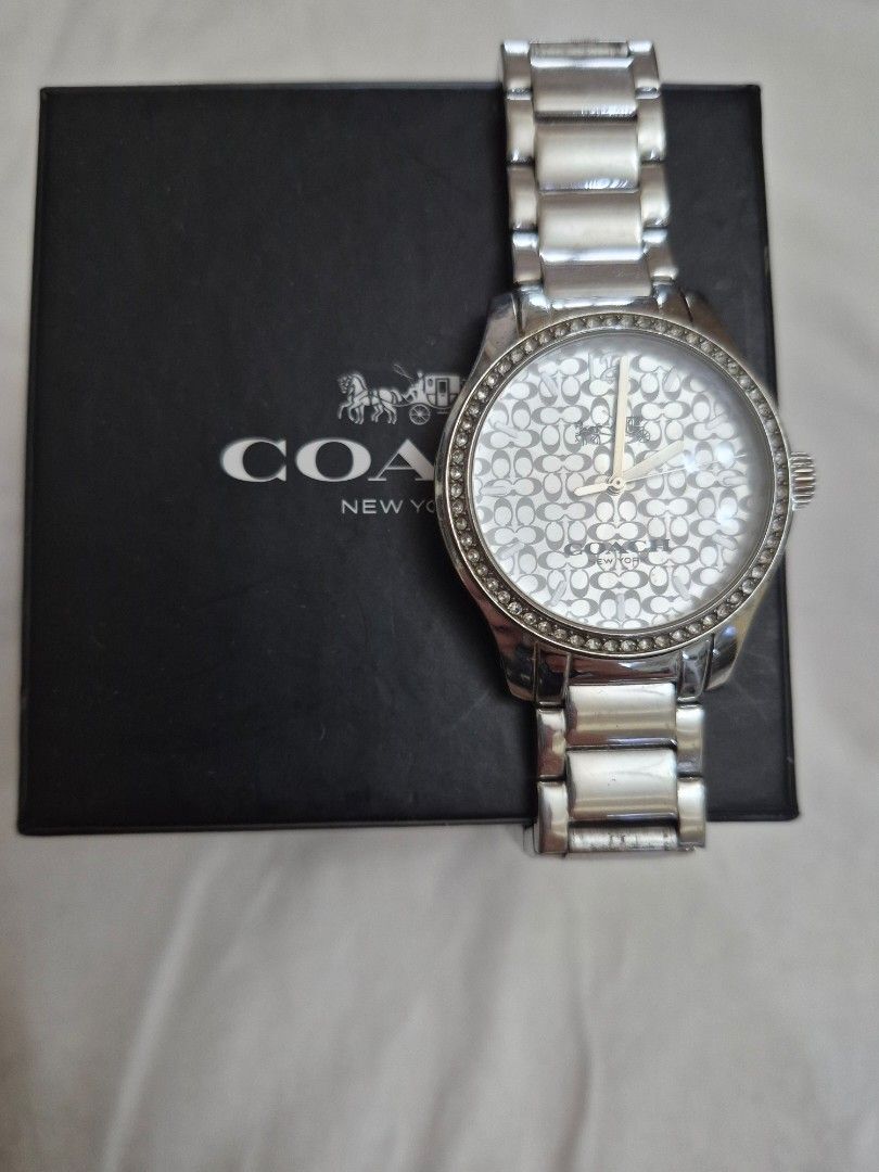 Coach Ladies Stainless Watch (Category: Women's Watches) located in Manila. Submitted by goldenphoenix_1e67c6 (Listing ID 1459967485, Image 2). Description: Brand: Coach New York Color: Silver Stainless steel bracelet White Coach signature-pattern dial Crystal/studded bezel design Comes with Coach box Pre-owned / gently used Watch is in good overall condition; please see photos for actual condition Bracelet may need adjustment depending on wrist 