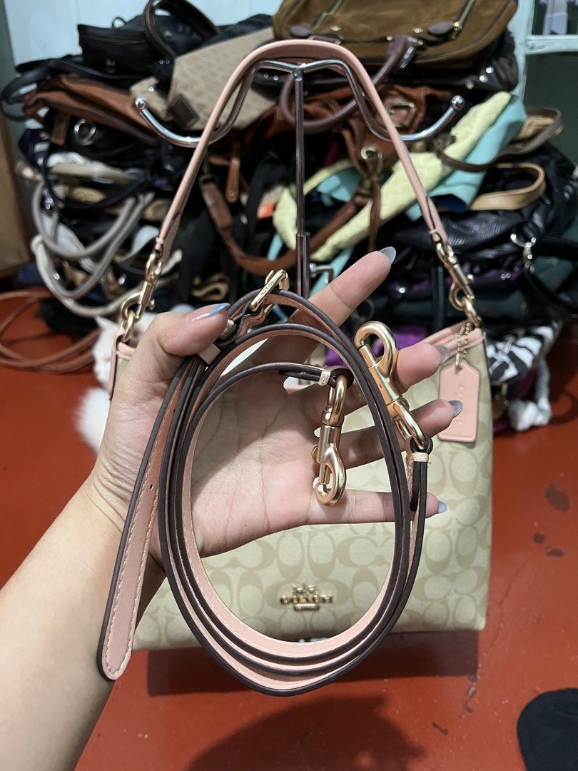 Coach Laurel (Category: Luxury Bags & Wallets) located in Manila. Submitted by bags_2.riches (Listing ID 1459901743, Image 2). Description: - Coach Signature Canvas Shoulder Bag - Color: Tan and Pink - Features Gold Hardware - Adjustable Shoulder Strap - Ideal for Everyday Use - Spacious Interior.