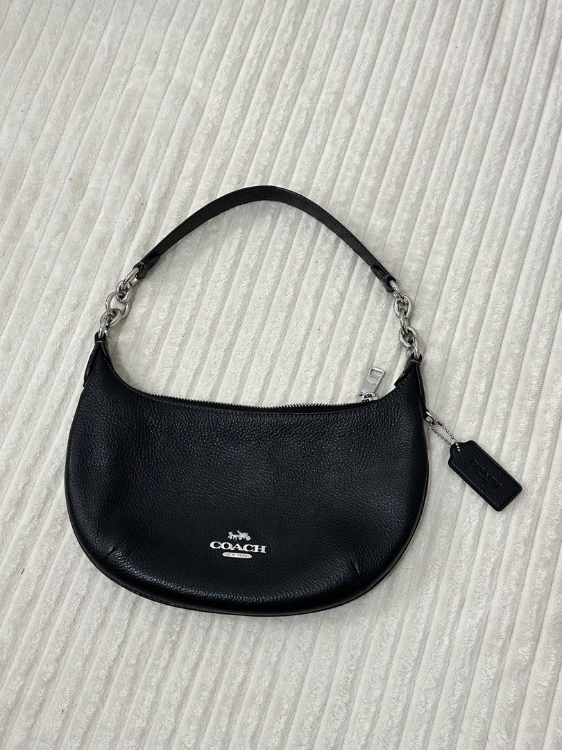 Coach Mini Payton Shoulder Bag (Category: Luxury Bags & Wallets) located in Urdaneta. Submitted by hellocity16 (Listing ID 1459979695, Image 1). Description: - Authentic Coach black leather shoulder bag - Features a stylish silver chain strap - Textured pebbled leather for a premium feel - Secure zipper closure - Ideal for everyday wear and tear.