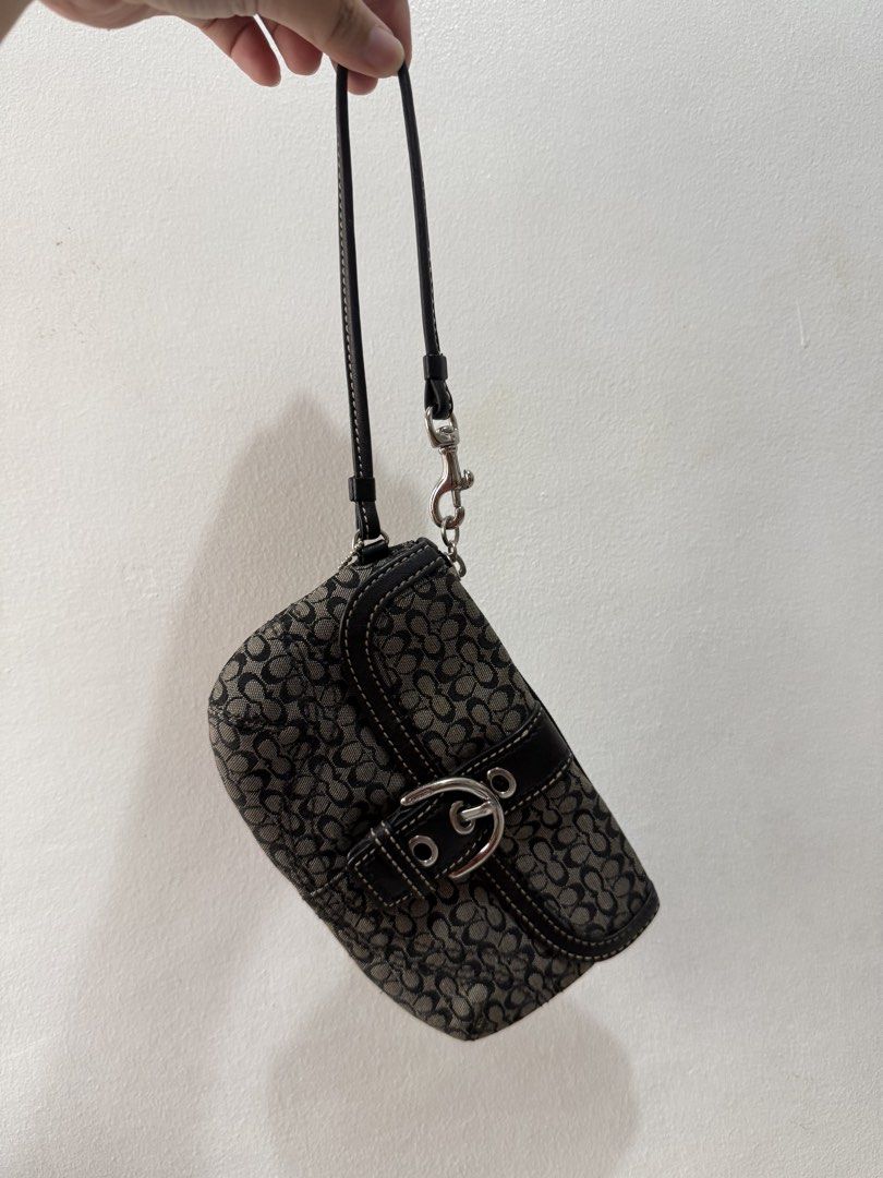 Coach Monogram Canvas & Leather Shoulder Bag (Category: Luxury Bags & Wallets) located in Manila. Submitted by jaylouvar65100 (Listing ID 1460004893, Image 2). Description: - Classic Coach shoulder bag - Signature monogram canvas with black leather trim - Buckle detail - Secure zipper closure - Silver hardware - Versatile: can be used as a wristlet or clutch - Ideal for everyday use or a night out - good condition - no issue - intact everything �