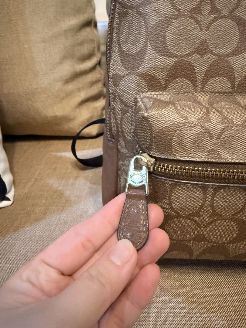 Coach Signature Canvas Backpack Brown (Category: Backpacks) located in San Fernando. Submitted by marynicole2911 (Listing ID 1459973402, Image 3). Description: - Authentic Coach backpack - Signature brown canvas with leather trim - Gold hardware with COACH logo - Front zip pocket - Main zip compartment - Clean inside and out - Smooth working zippers - Ideal for everyday use or travel - Personally used with care - Authentic, bought from Europe - I