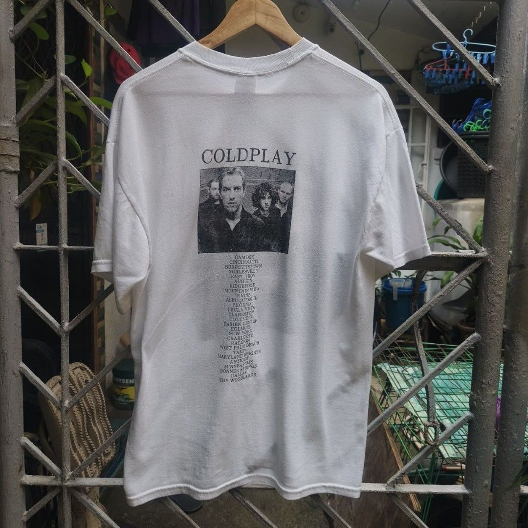 Coldplay 2005 Tour Shirt (Category: Shirts) located in Marikina City. Submitted by rvrctt (Listing ID 1459917762, Image 2). Description: Coldplay Tour 2005. From the Twisted Logic Tour in support of X&Y. Classic front photo print with the full North American tour stops on the back. A proper piece from one of Coldplay's biggest touring eras. 22 × 28 ₱5,499 💳 Gcash • Wise Marikina 📍 DM for more details..