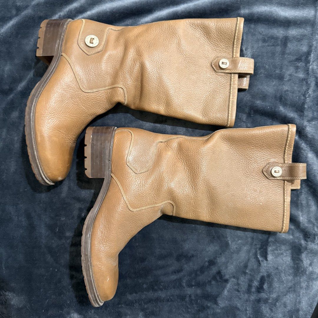 Cole Haan Leather Boots (Category: Boots) located in Cainta. Submitted by missbelle.ph (Listing ID 1460018878, Image 1). Description: Very fashionable! Perfect for your next Autumn Trip. Original Cole Haan Pure Leather Boots Size: 7.5 Best fits size 23.0 to 23.5cm if mag socks na makapal. Pwede sa 24cm pero manipis na socks lang. Note: *No box. *Needs cleaning lang. Use leather cleaner. *Also may missing button on left boot. See last photo..