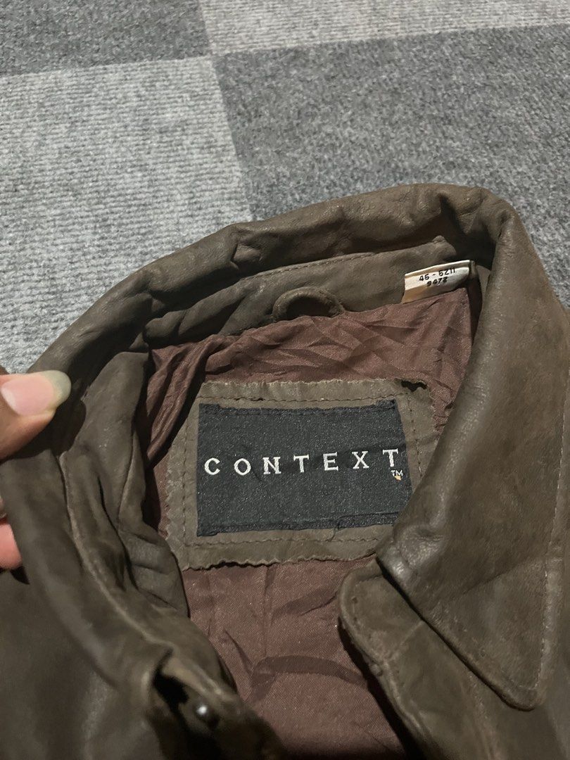 CONTEXT vintage 90’s leather bomber jacket (Category: Coats, Jackets and Outerwear) located in Naga. Submitted by kots_rojan (Listing ID 1460029126, Image 2). Description: in excellent condition size L tall best fit xl to semi xxl 26*28.5 no issues complete tags color and condition rate 8.5/10 good condition for vintage .