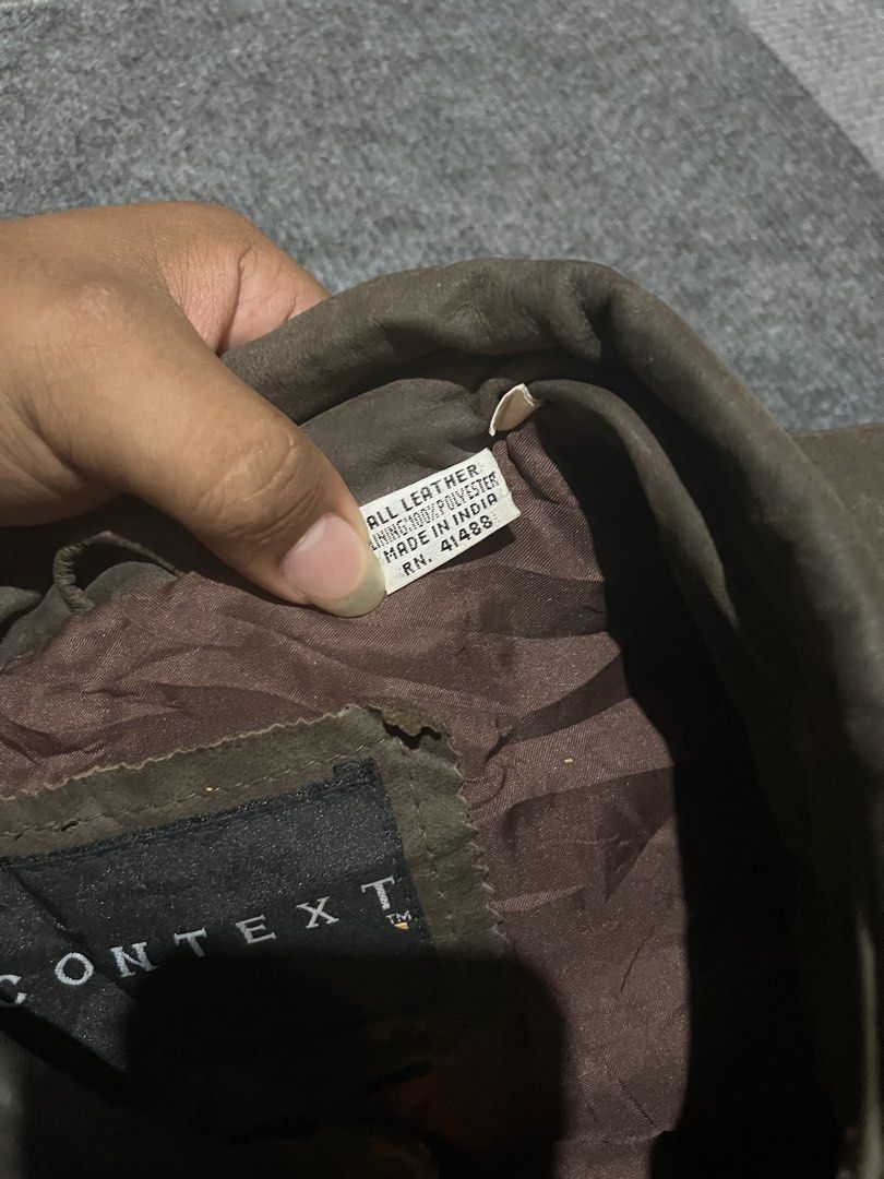 CONTEXT vintage 90’s leather bomber jacket (Category: Coats, Jackets and Outerwear) located in Naga. Submitted by kots_rojan (Listing ID 1460029126, Image 3). Description: in excellent condition size L tall best fit xl to semi xxl 26*28.5 no issues complete tags color and condition rate 8.5/10 good condition for vintage .