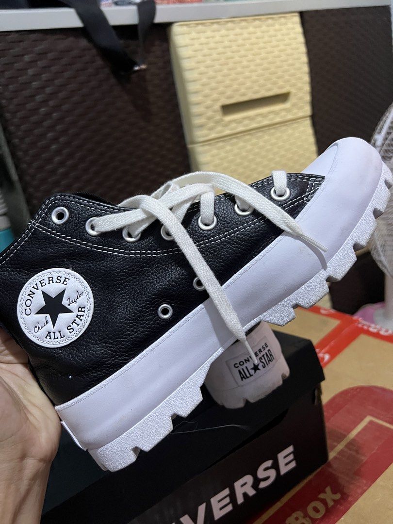 Converse Chuck Taylor All Star Lugged Platform High Top (Category: Sneakers) located in Cabanatuan. Submitted by imported2023 (Listing ID 1459992471, Image 3). Description: - Black leather Converse high tops - Chunky white platform sole - Classic Chuck Taylor style with a modern twist - White laces - Made in Vietnam - Size: US Women's 7.5.