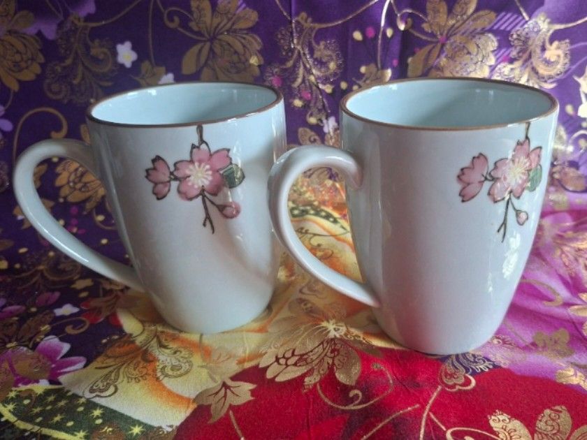 Corelle Coordinates Mug Set of 2 (Category: Coffee & Tea Tableware) located in Consolacion. Submitted by luxekerei (Listing ID 1457240256, Image 2). Description: - are Corelle Coordinates Cherry Blossom porcelain mugs featuring a delicate pink floral branch motif and a subtle brown rim.