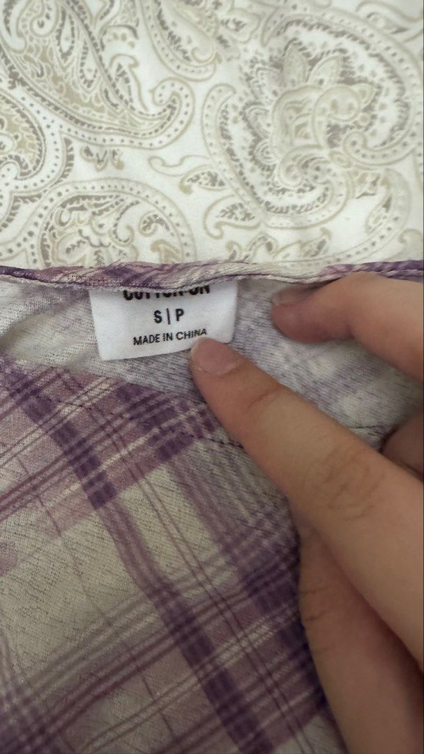 Cotton On Plaid Sleeveless Top Size S (Category: Sleeveless) located in Makati City. Submitted by shaniahdeclutters (Listing ID 1459970487, Image 2). Description: - Cotton On sleeveless top - Purple and beige plaid pattern - Simple and casual design - Perfect for layering or wearing solo - Fits size S.